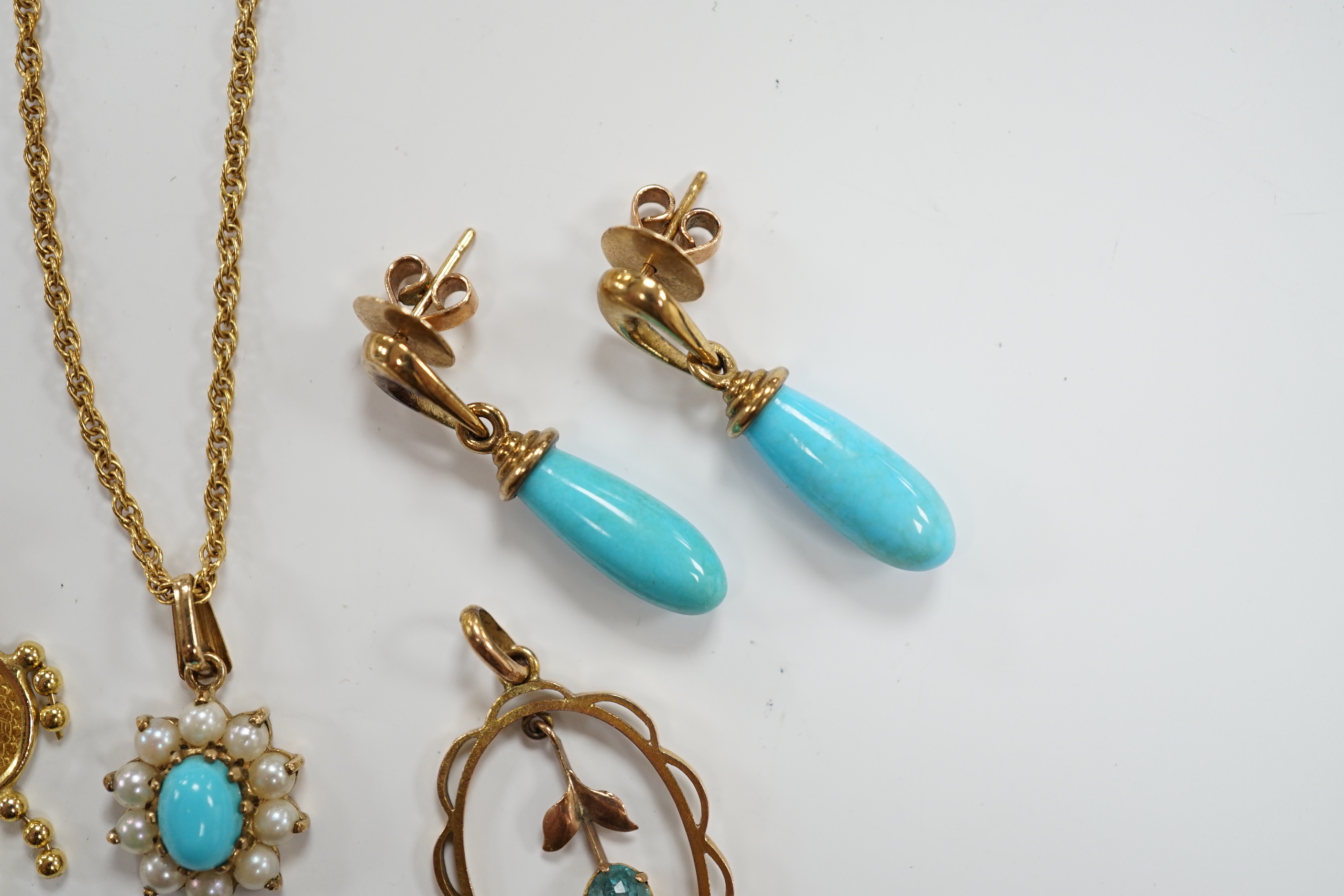 A modern 9ct gold, turquoise and seed pearl cluster set pendant necklace, a pair of 9ct gold and turquoise set drop earrings and two yellow metal pendants, gross weight 9.7 grams.